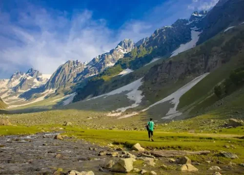 A scenic mountain pass on Mughal Road with clouds and alpine beauty.